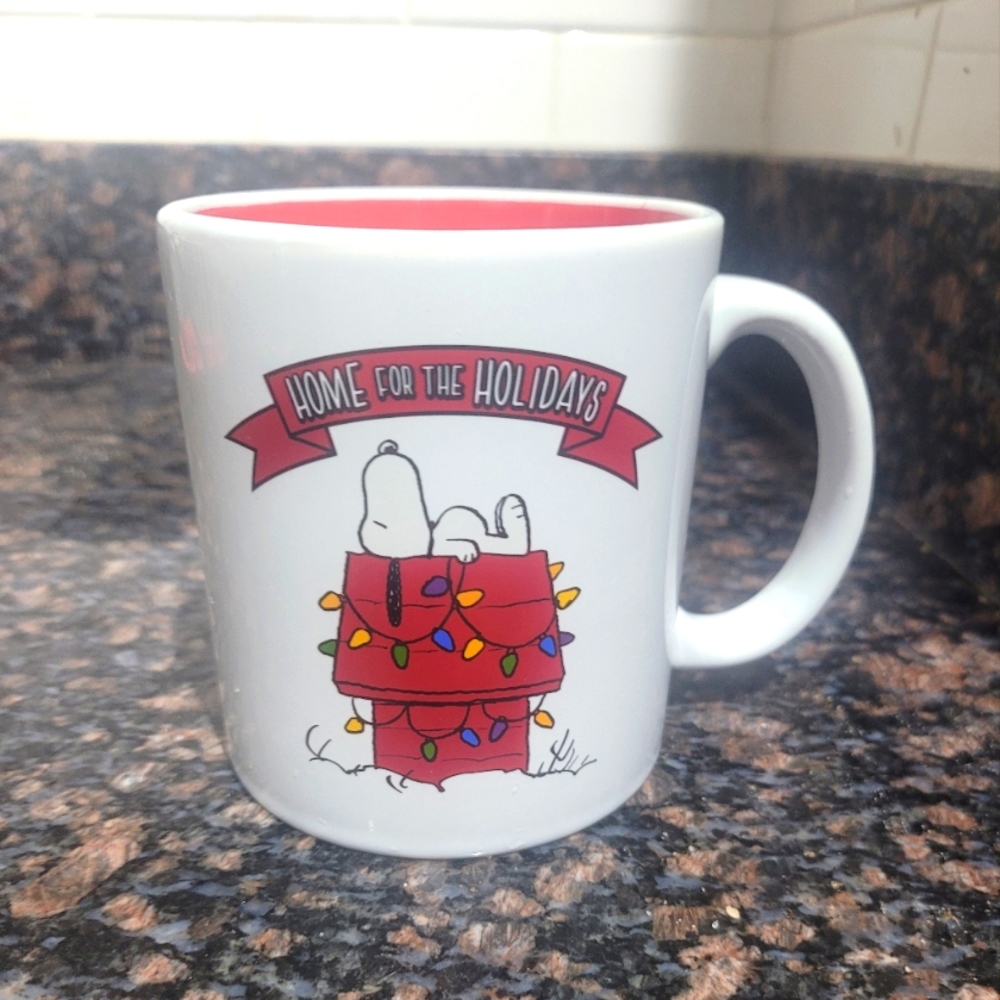 Peanuts home for the holidays mug featuring snoopy